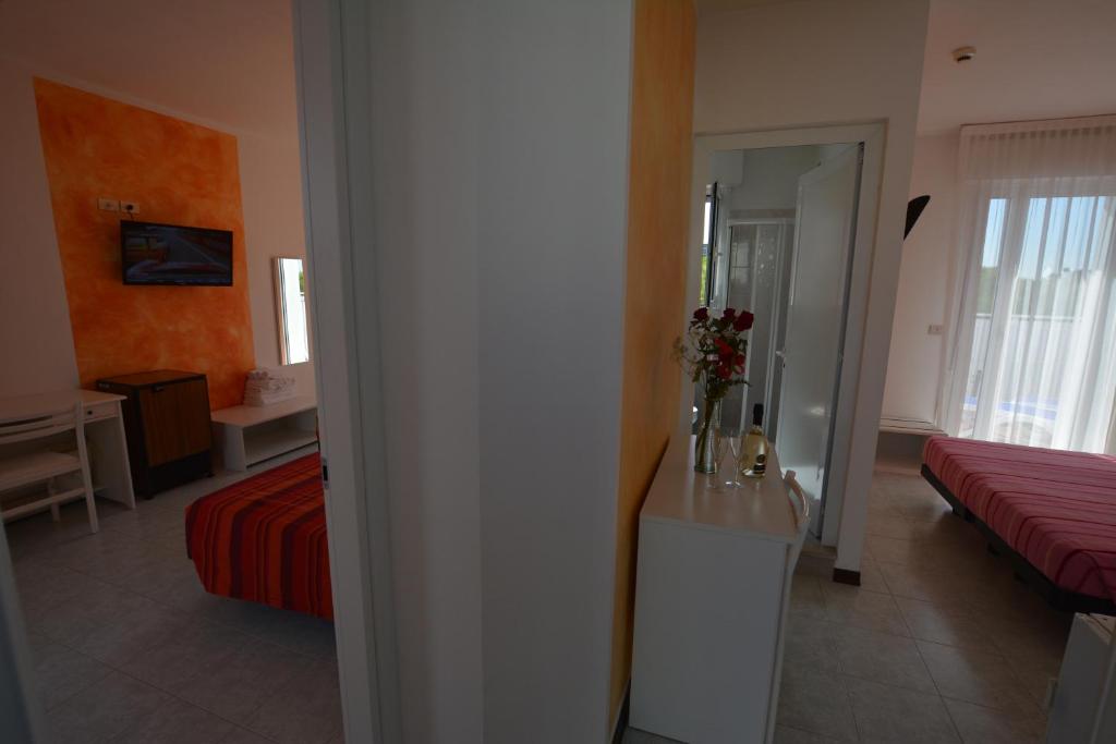 Postel nebo postele na pokoji v ubytování Hotel Nuova Graziosa