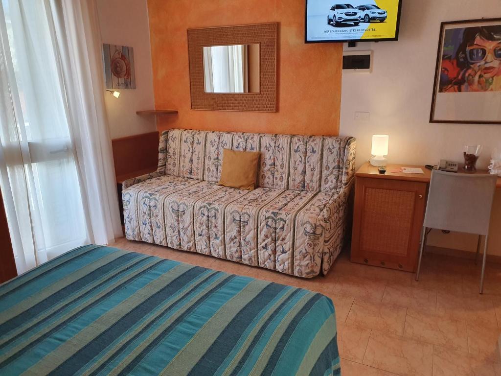 Postel nebo postele na pokoji v ubytování Hotel Nuova Graziosa