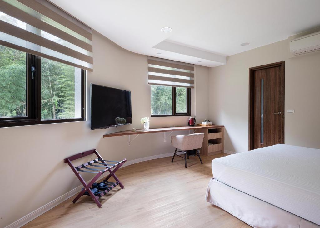 TV a/nebo společenská místnost v ubytování 名竹旅社 Minzu Hotel