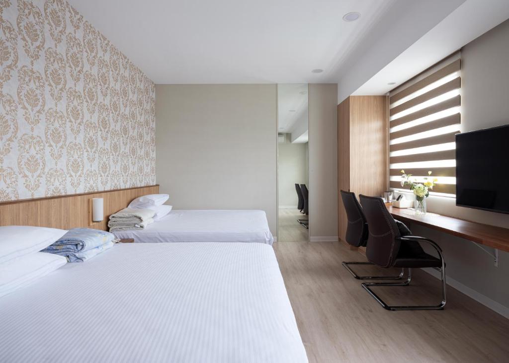 TV a/nebo společenská místnost v ubytování 名竹旅社 Minzu Hotel