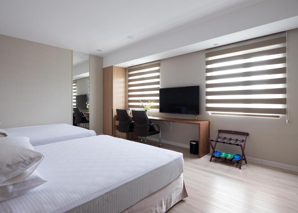 TV a/nebo společenská místnost v ubytování 名竹旅社 Minzu Hotel