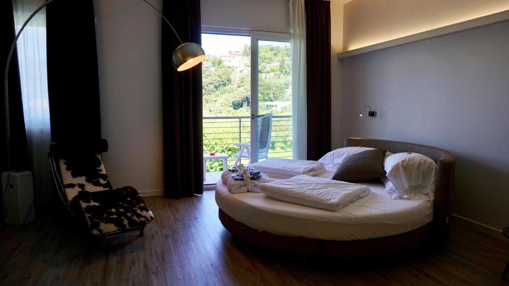 Postel nebo postele na pokoji v ubytování Park Hotel Val Di Monte ***S