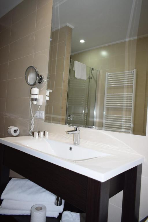 Koupelna v ubytování Hotel Regal