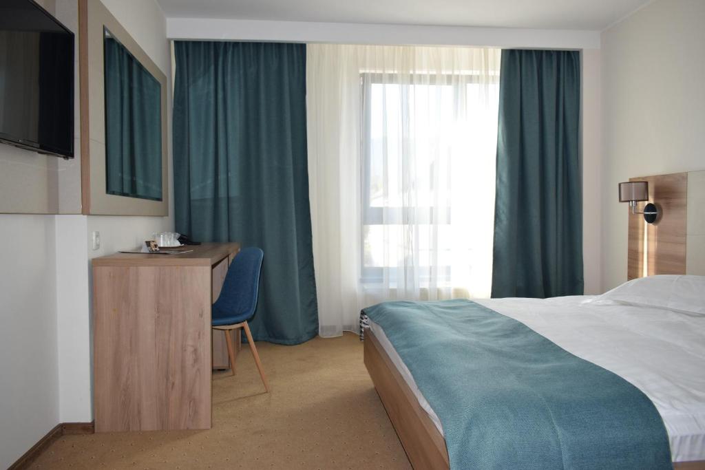 Postel nebo postele na pokoji v ubytování Hotel Regal