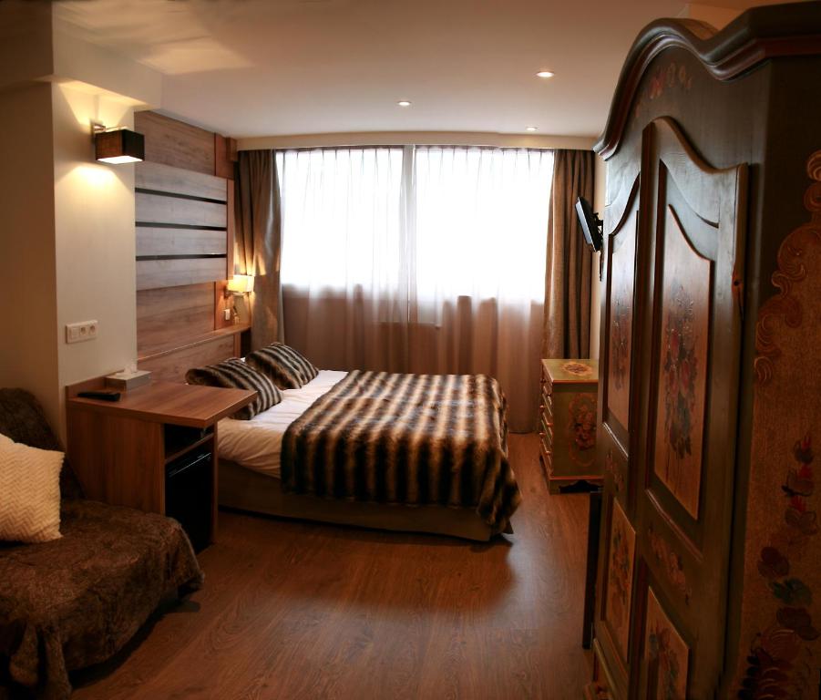 Postel nebo postele na pokoji v ubytování Hôtel Vallée Blanche