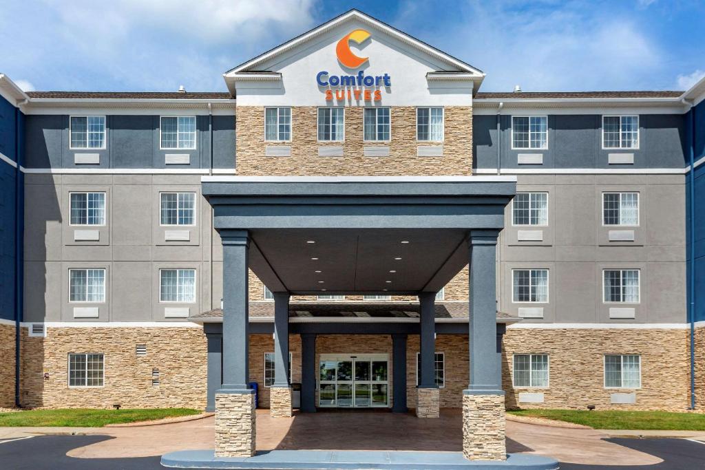 a building with a sign on the front of it at Comfort Suites in Clarksville