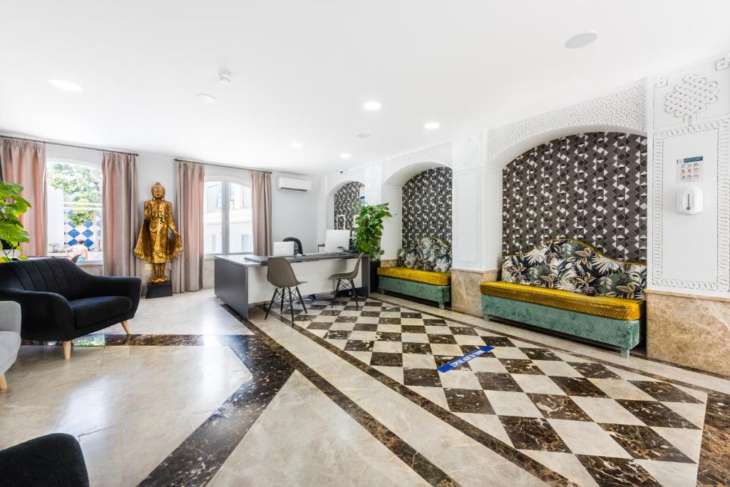 a living room with a checkered floor at Toboso Apar - Turis in Nerja