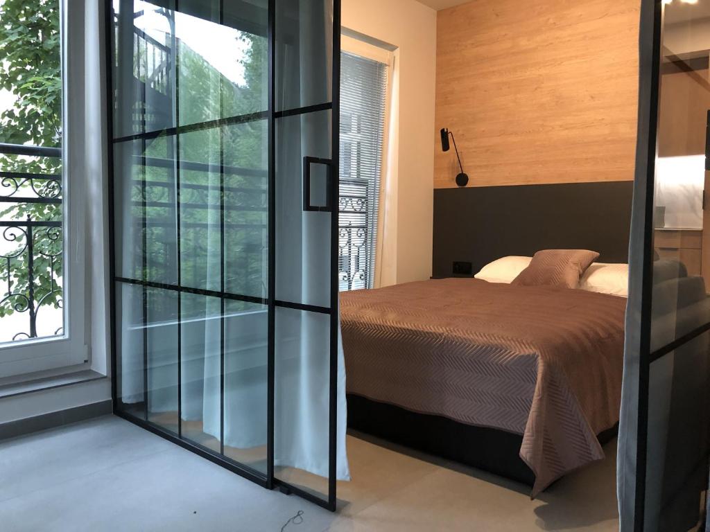Posteľ alebo postele v izbe v ubytovaní Apartament Lena Stare Miasto