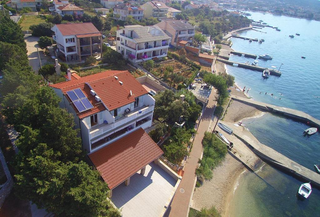 an aerial view of a house next to the water at Apartments Anita 2 in Rab