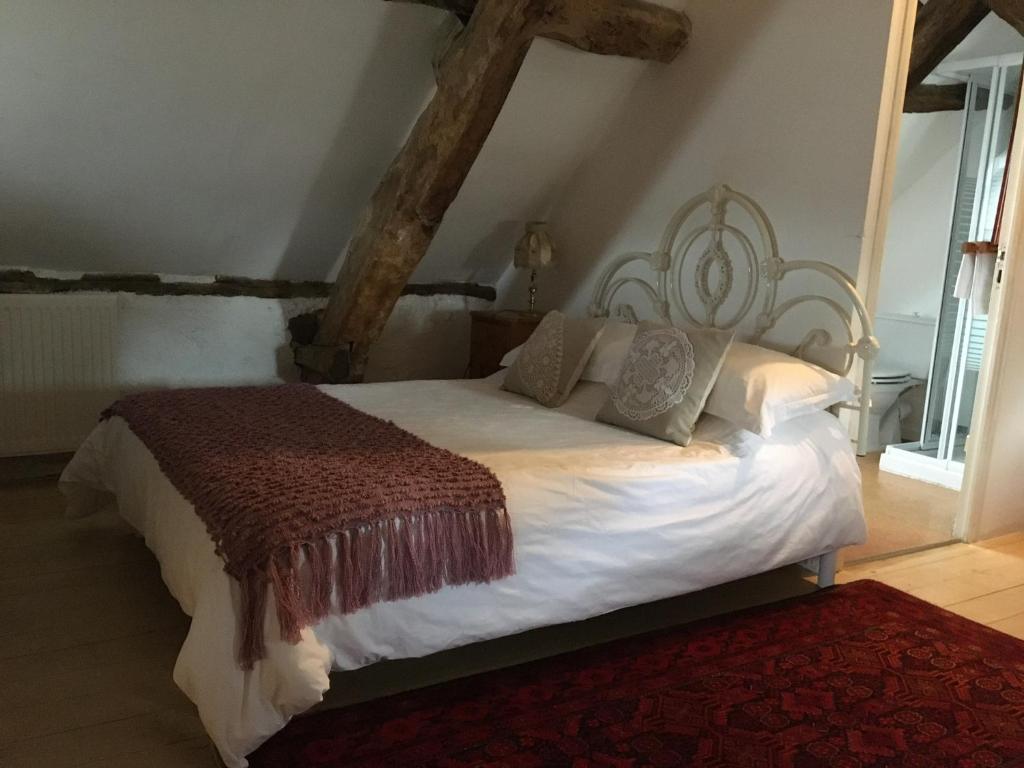 Postel nebo postele na pokoji v ubytování Pérard Chambres D’Hotes