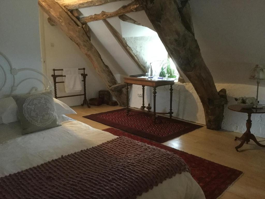 Postel nebo postele na pokoji v ubytování Pérard Chambres D’Hotes
