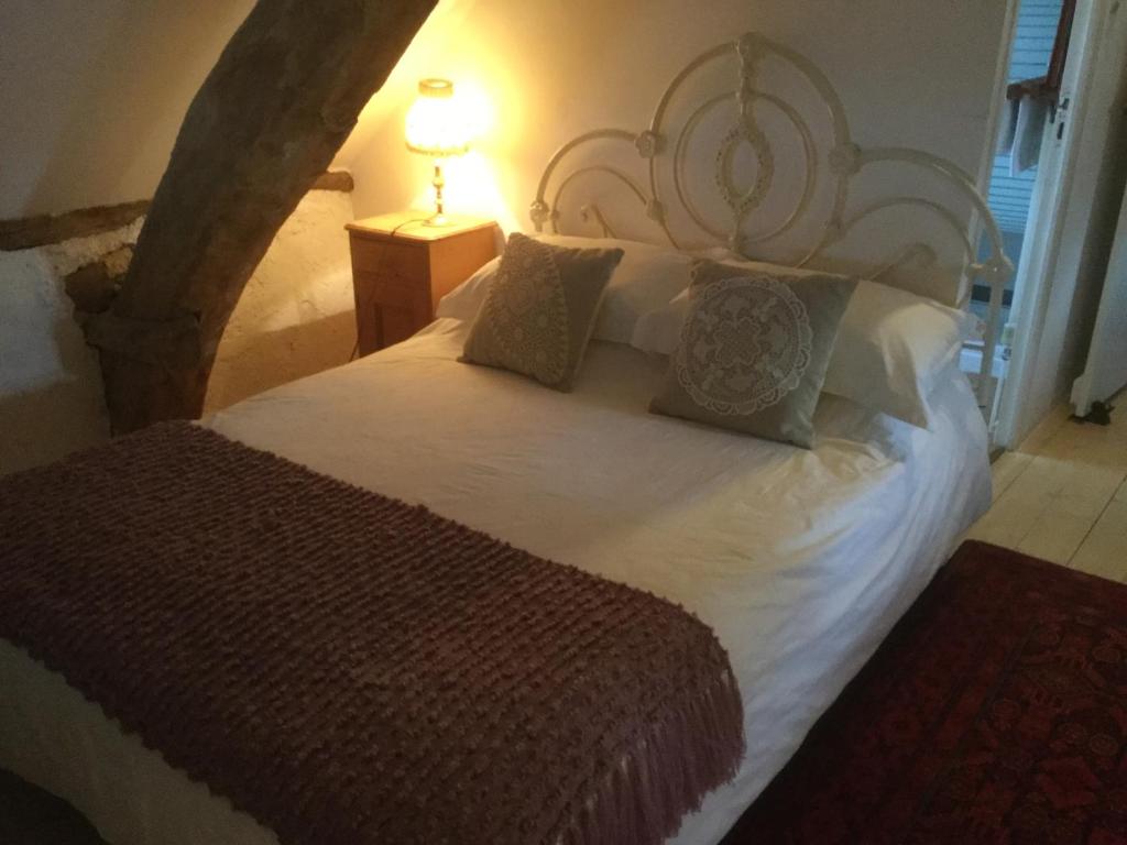 Postel nebo postele na pokoji v ubytování Pérard Chambres D’Hotes