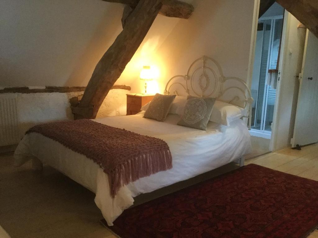 Postel nebo postele na pokoji v ubytování Pérard Chambres D’Hotes