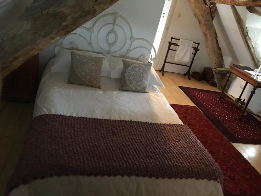Postel nebo postele na pokoji v ubytování Pérard Chambres D’Hotes