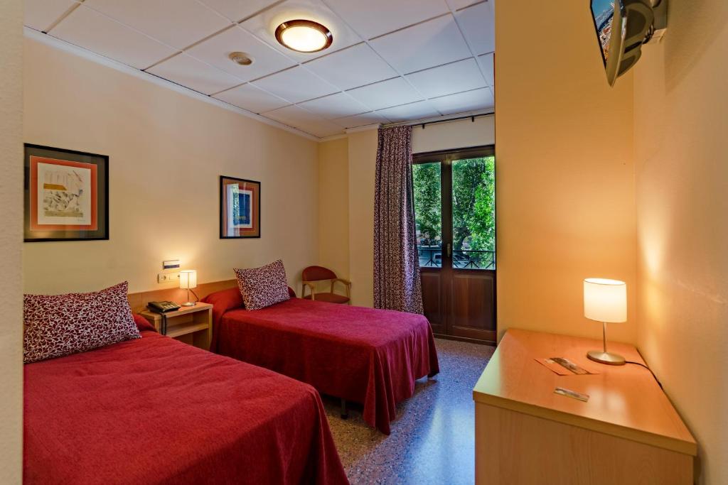 מיטה או מיטות בחדר ב-Hotel Anna