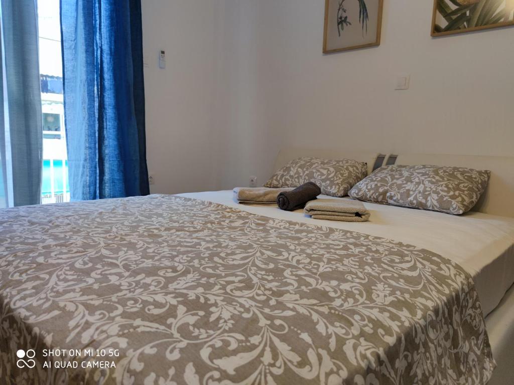 Postel nebo postele na pokoji v ubytování Studio in Kallithea next to Kiprou square
