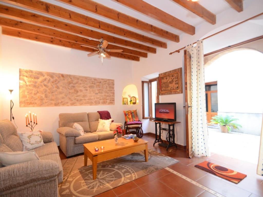 a living room with a couch and a table at Sant Vicenç, amazing house in Alcudia for 6 in Alcudia