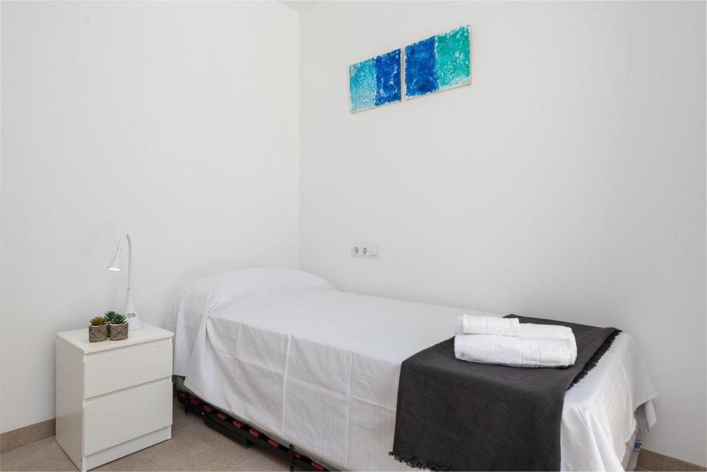 Postel nebo postele na pokoji v ubytování Mirador Blue F - Cala Sant Vicenç
