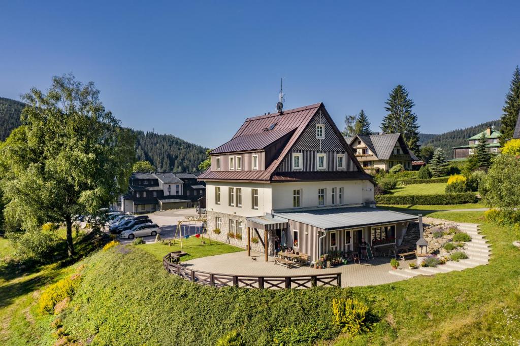 an aerial view of a large house on a hill at MINERVA in Špindlerův Mlýn