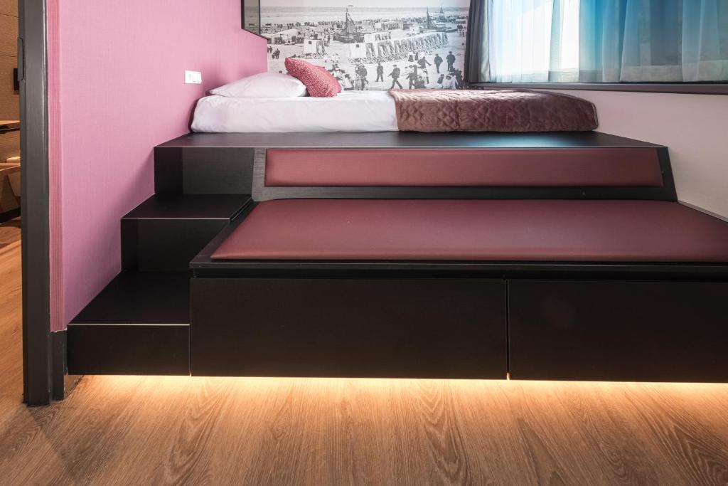 Postel nebo postele na pokoji v ubytování Palace Hotel Zandvoort