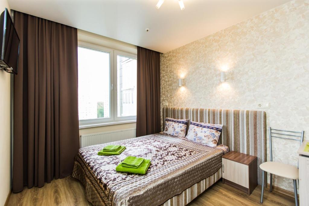 Un pat sau paturi într-o cameră la Sokol-Hotel