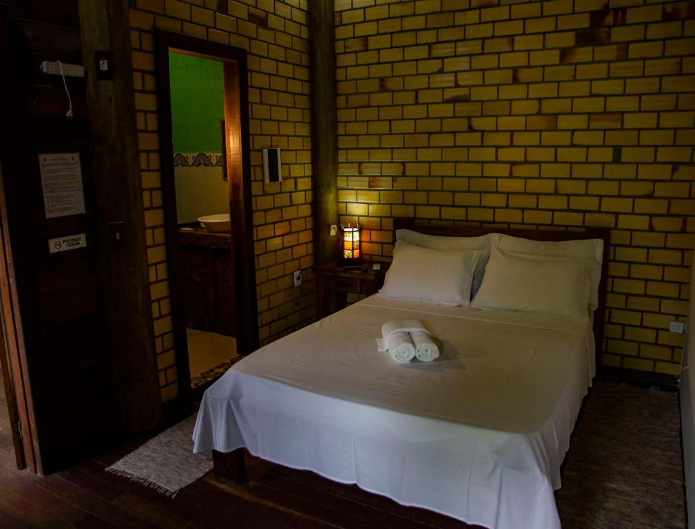 Cama ou camas em um quarto em Pousada Favo De Mel