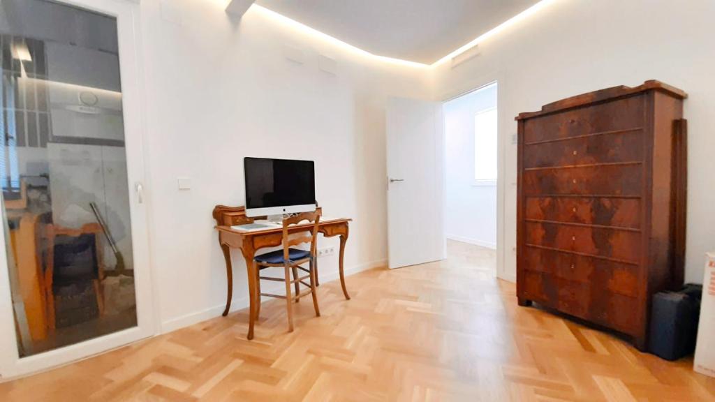 TV a/nebo společenská místnost v ubytování Valencia Town Hall Dream