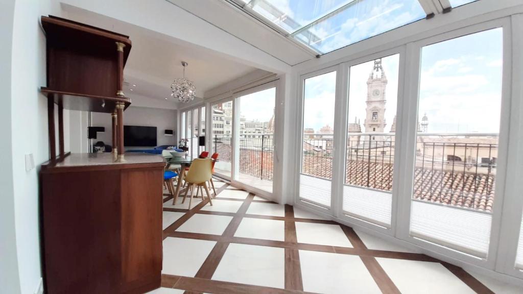 a room with large windows and a view of a building at Valencia Town Hall Dream in Valencia