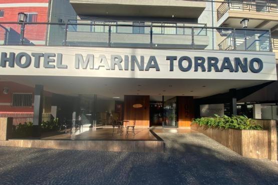 a hotel marina toronto sign on the front of a building at Hotel Marina Torrano in Trindade