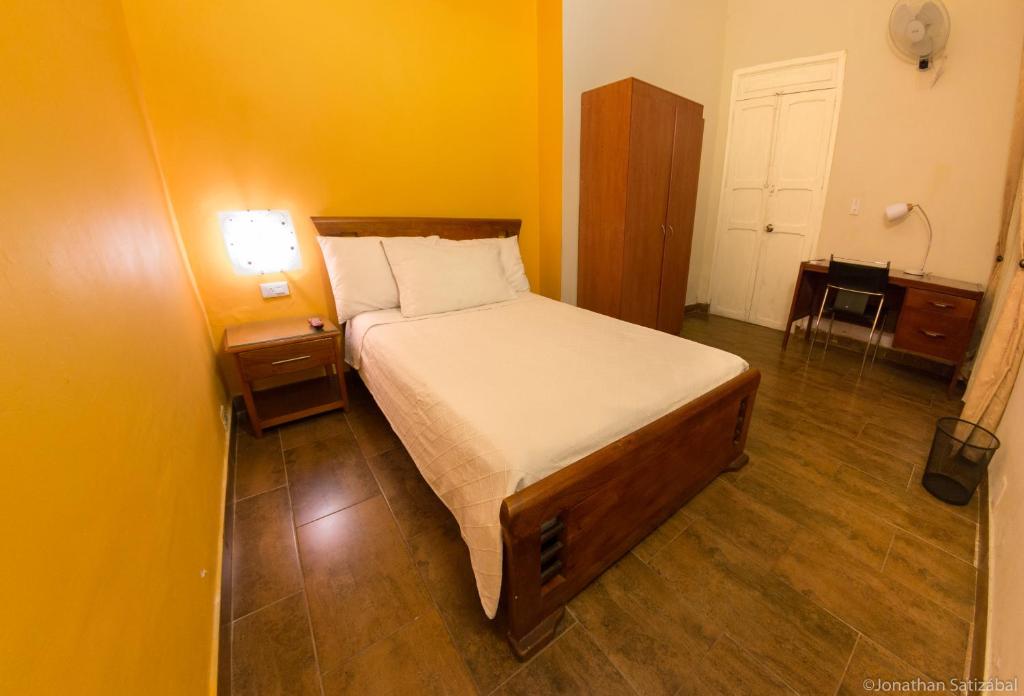 Postel nebo postele na pokoji v ubytování 61Prado Hotel