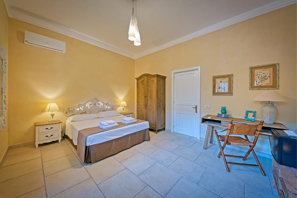 Postel nebo postele na pokoji v ubytování b&b Casale Vecchio Lecce