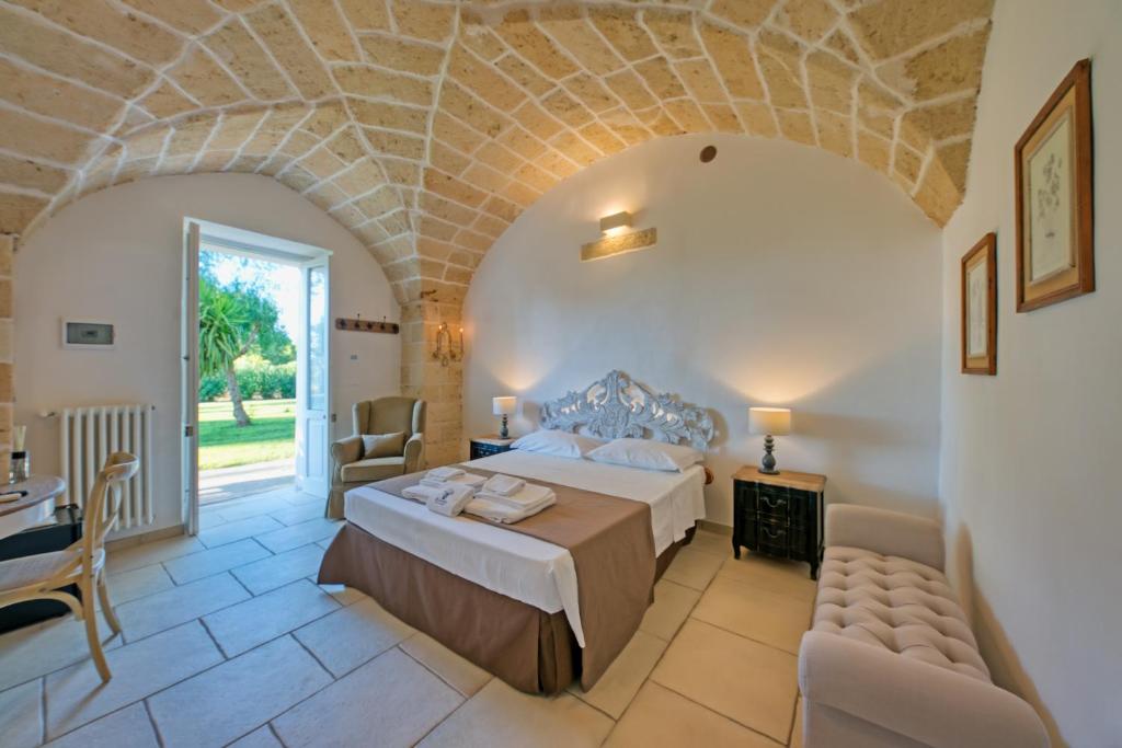 Postel nebo postele na pokoji v ubytování b&b Casale Vecchio Lecce