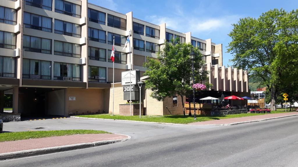 an empty street in front of a building at Greenwood Inn & Suites in Corner Brook