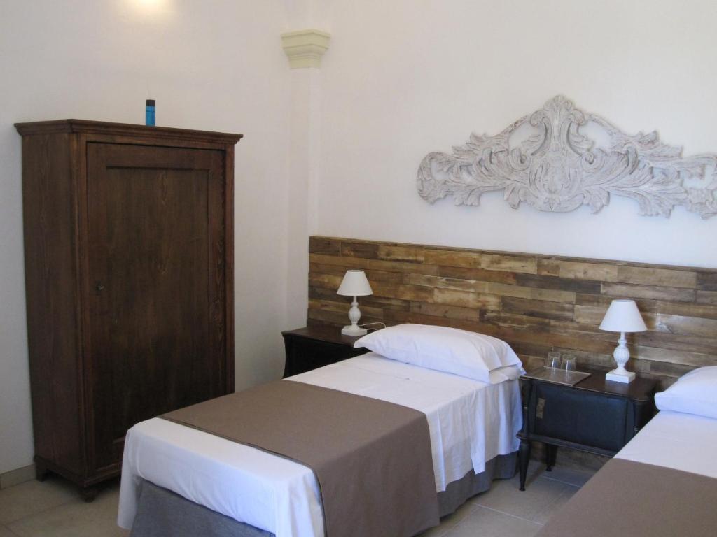 Postel nebo postele na pokoji v ubytování b&b Casale Vecchio Lecce