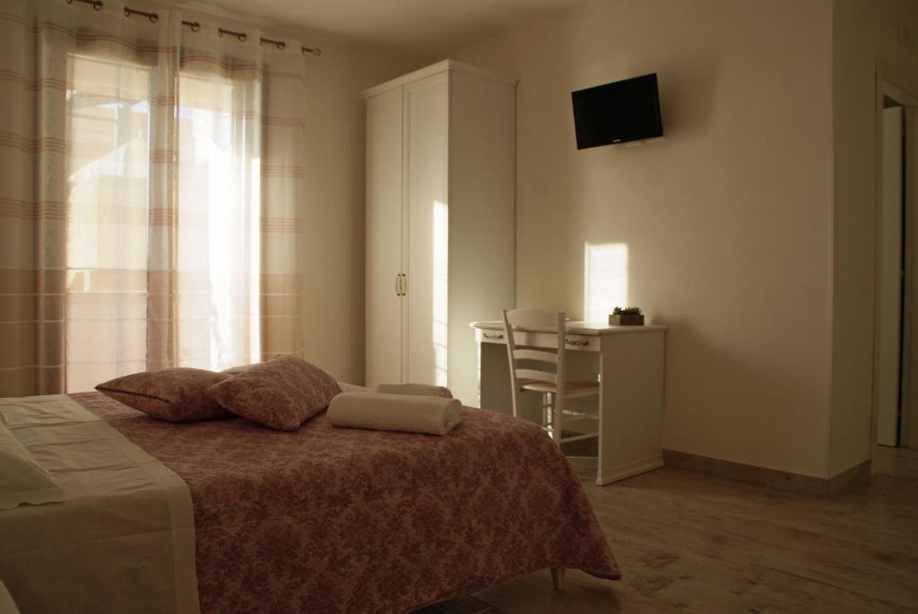 Postel nebo postele na pokoji v ubytování Stella Fenicia