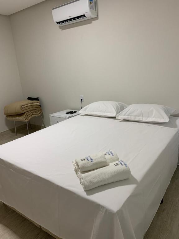 Postel nebo postele na pokoji v ubytování Suites Paraíso de Minas