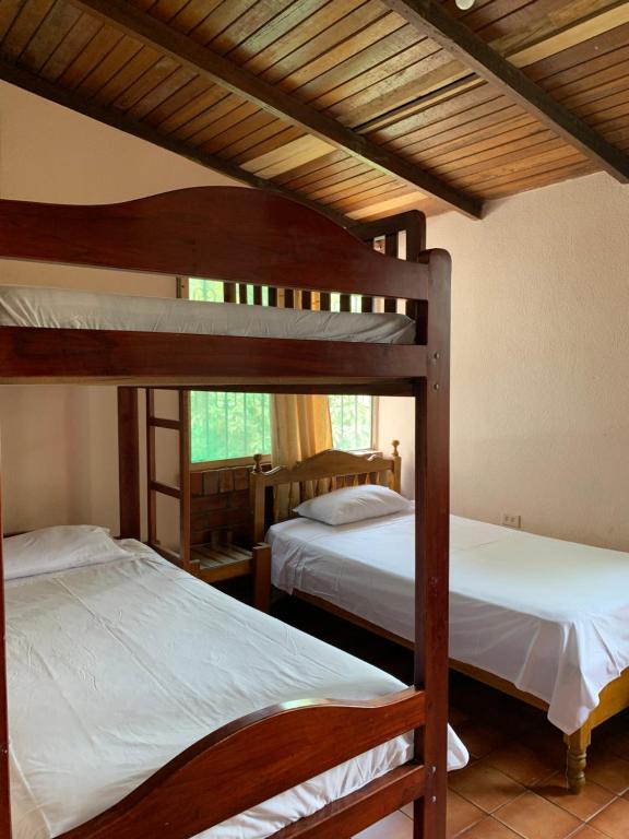 Postel nebo postele na pokoji v ubytování Cabañas Ecologicas Cayapas