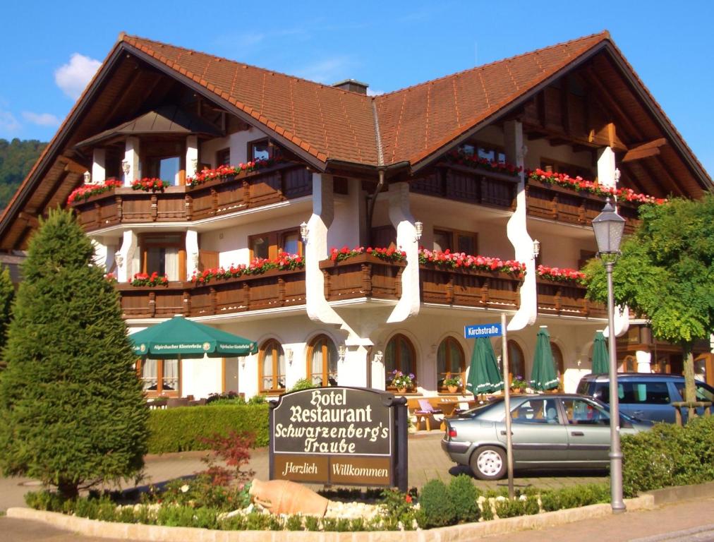 a large building with a sign in front of it at Hotel Schwarzenbergs Traube in Glottertal