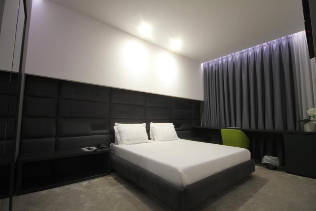 Postel nebo postele na pokoji v ubytování Albes Hotel