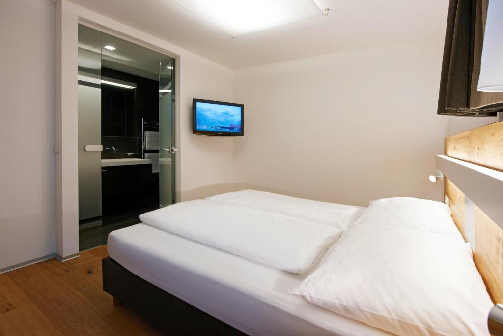 Postel nebo postele na pokoji v ubytování Sport- und Genusshotel Silvretta