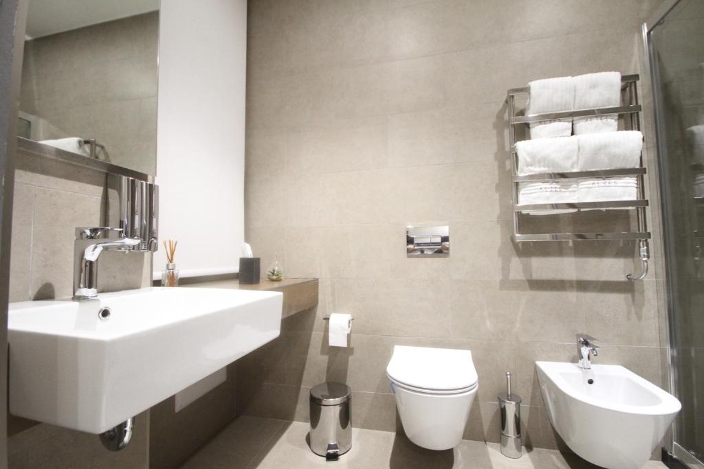 Koupelna v ubytování Albes Hotel