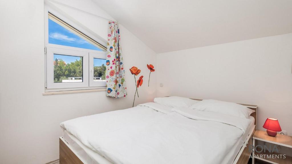 Postel nebo postele na pokoji v ubytování Rona Apartments Zlatko