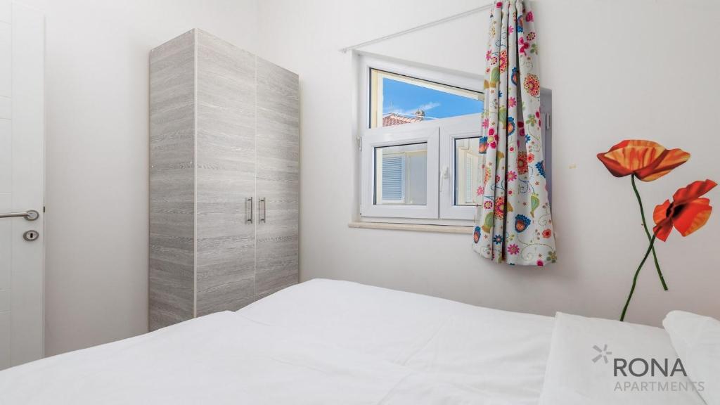 Postel nebo postele na pokoji v ubytování Rona Apartments Zlatko