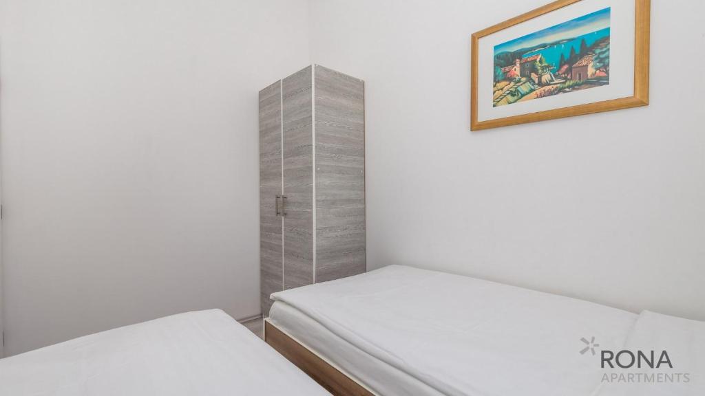 Postel nebo postele na pokoji v ubytování Rona Apartments Zlatko