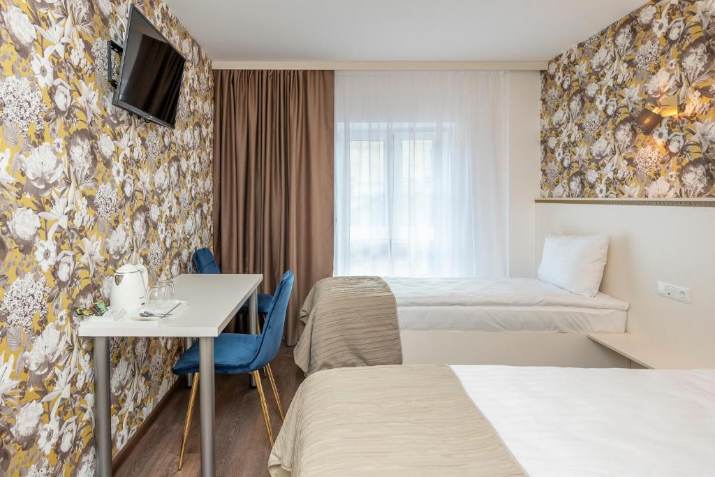 Postel nebo postele na pokoji v ubytování Kesminta Apartments