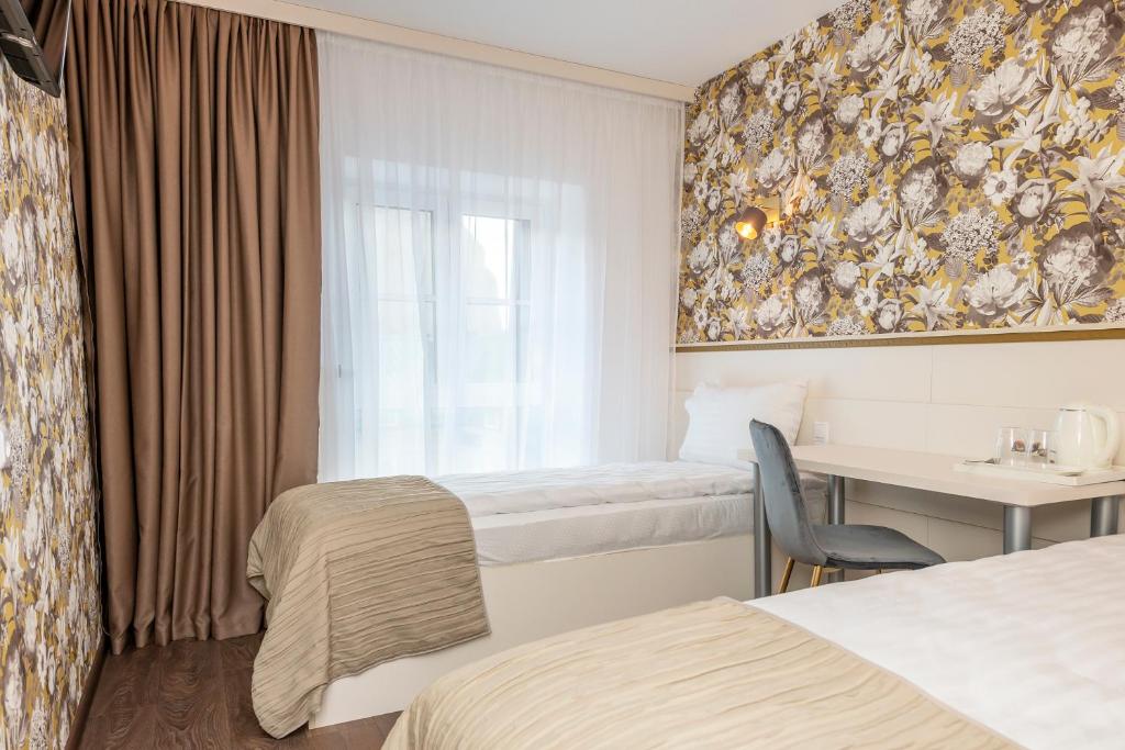 Postel nebo postele na pokoji v ubytování Kesminta Apartments