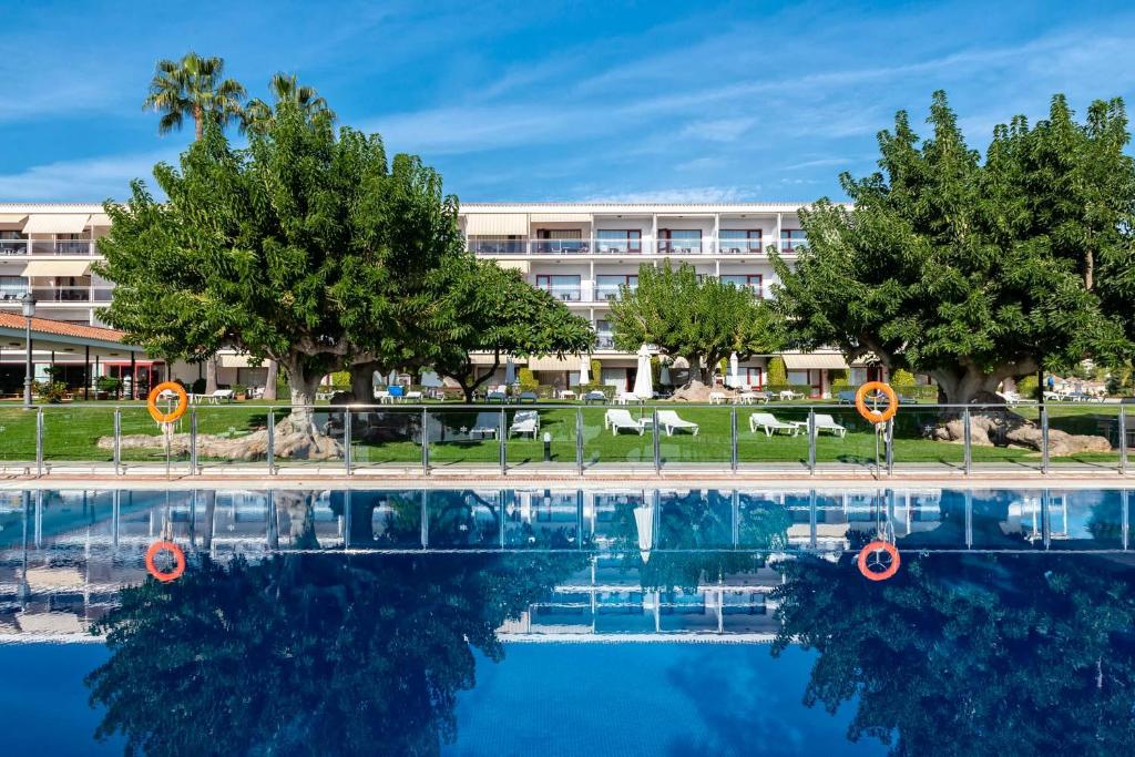 a large swimming pool in front of a hotel at Parador de Nerja in Nerja