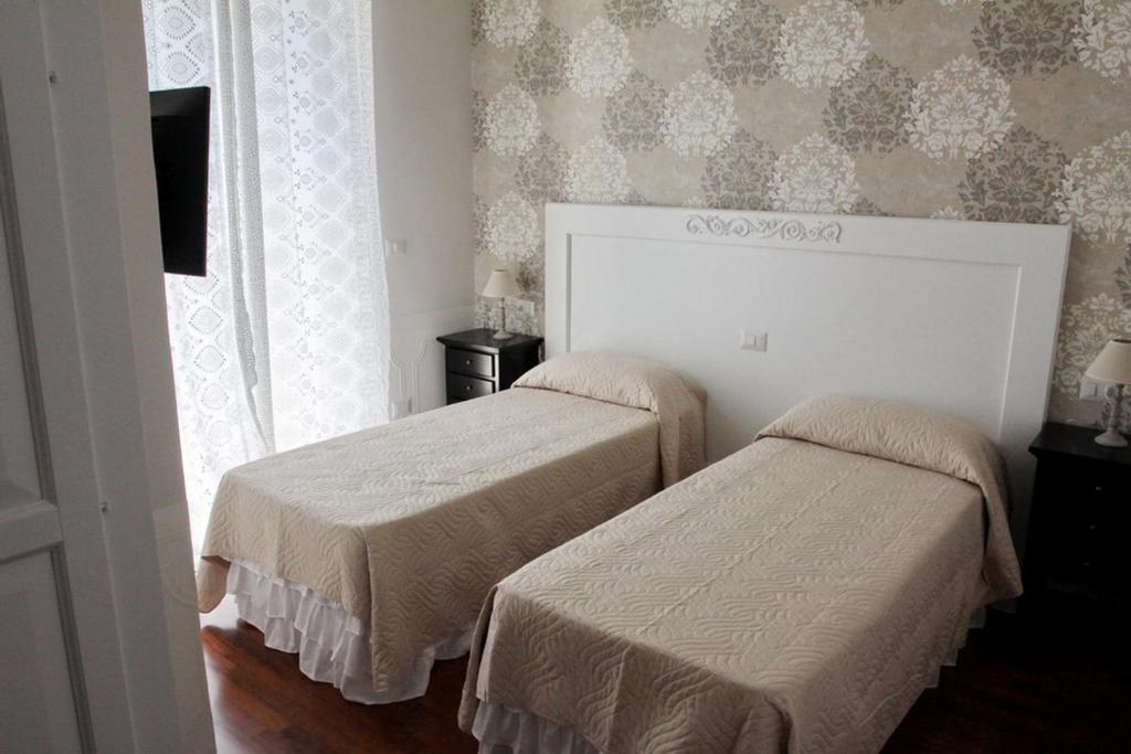 Postel nebo postele na pokoji v ubytování Casa Parthenope