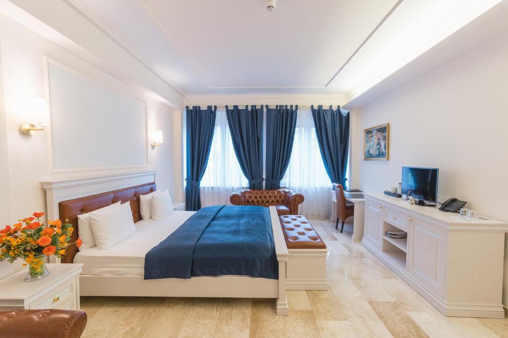 Postel nebo postele na pokoji v ubytování Grand Hotel Palladium