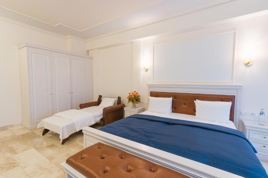 Postel nebo postele na pokoji v ubytování Grand Hotel Palladium
